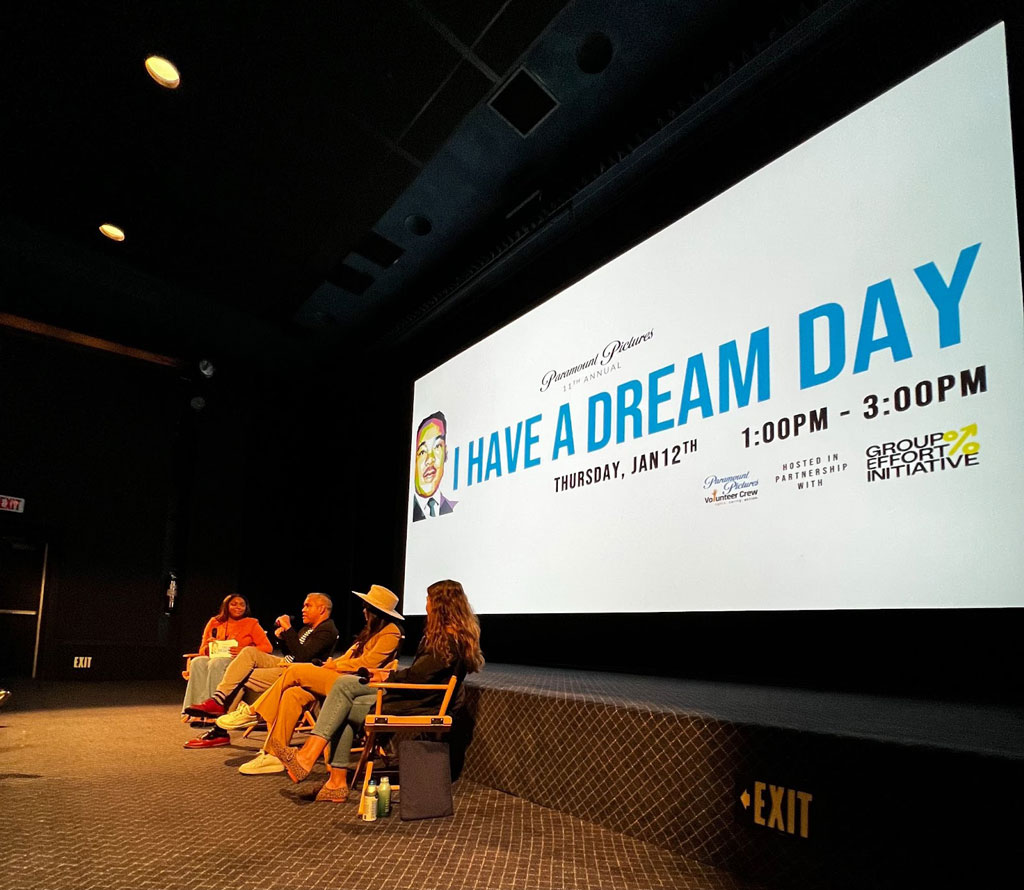 Photo of panelists in front of screen with text "I Have A Dream Day".